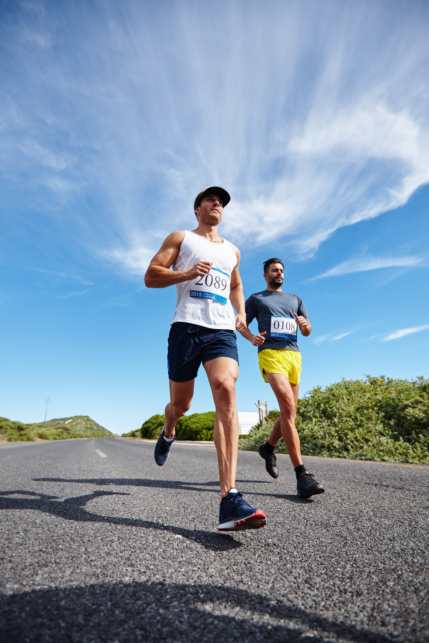 Hes catching up. Shot of a group of young men running a marathon. Shot of a group of young men running a marathon.